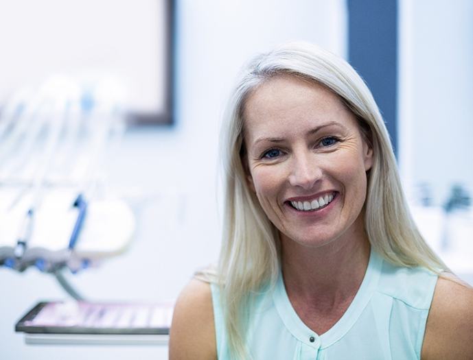 Woman with white hair visiting dentist for dental checkup and cleaning in Grosse Pointe Woods