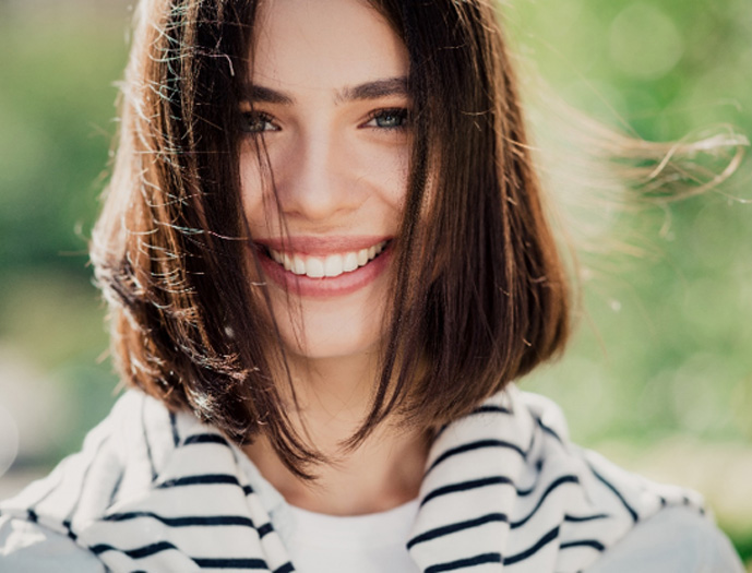 Close-up portrait of woman with beautiful smile