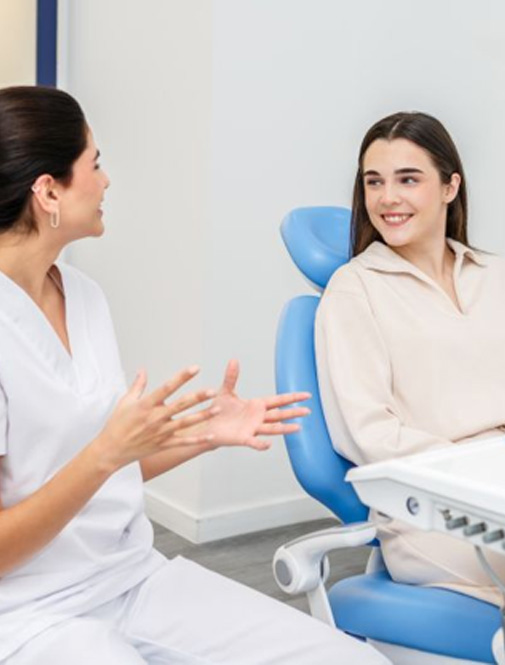 Patient and dental team member having lively conversation